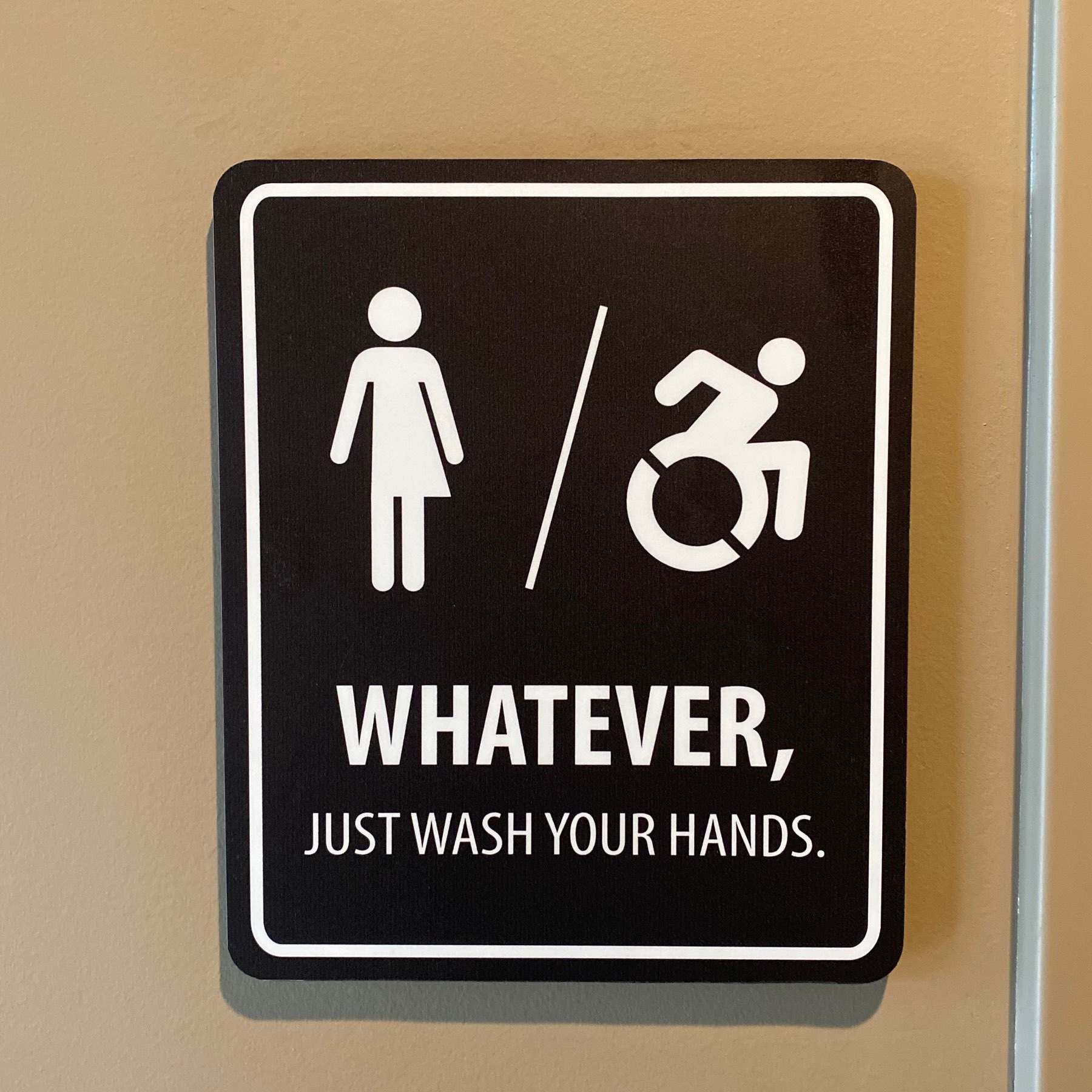 Non-gendered bathroom sign